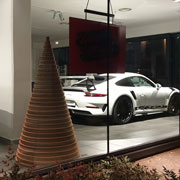 Ecodesign: Alberi di Natale in cartone by Lessmore, Design Giorgio Caporaso per l'autosalone Porsche a Varese. Natale Green ed ecosostenibile